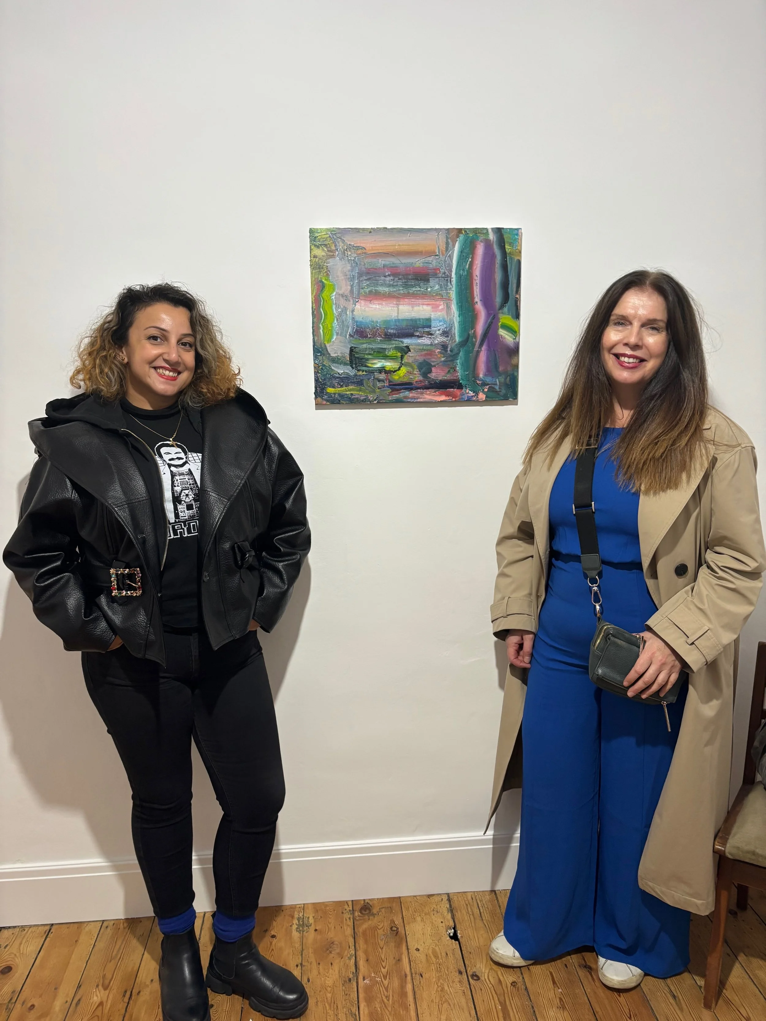 Exhibition Curator Halime Eleni Özdemir di Larusso with artist Diana Copperwhite at the opening of 'Existential Licence' in London curated with artist Shaun McDowell.