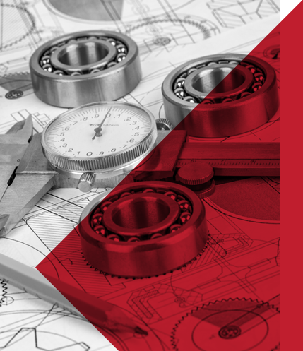 Mechanical parts including ball bearings on engineering blueprints with a dial gauge and a protractor for measurement.