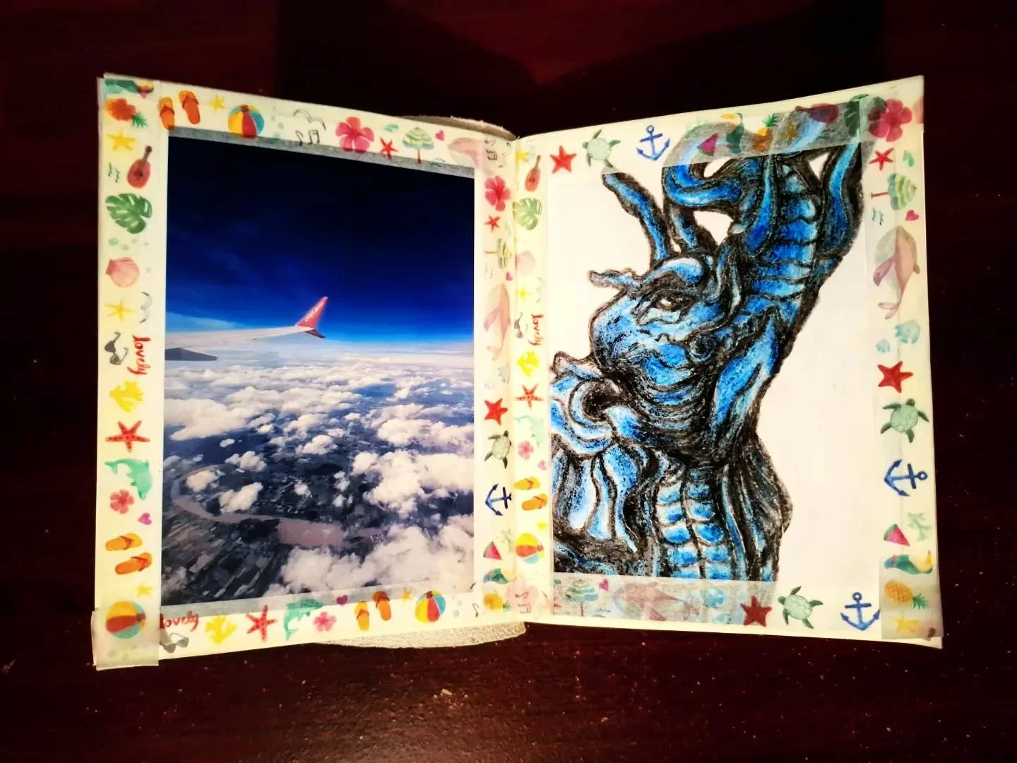 First drawing completed for the travel scrapbooks! 😁

This one is a close up of a blue elephant statue I saw at a temple in Chiang Rai, Thailand. I drew it with crayons. 🐘

The plane was taken on a flight from Bangkok to Chiang Mai. ✈️

#scrapbook 