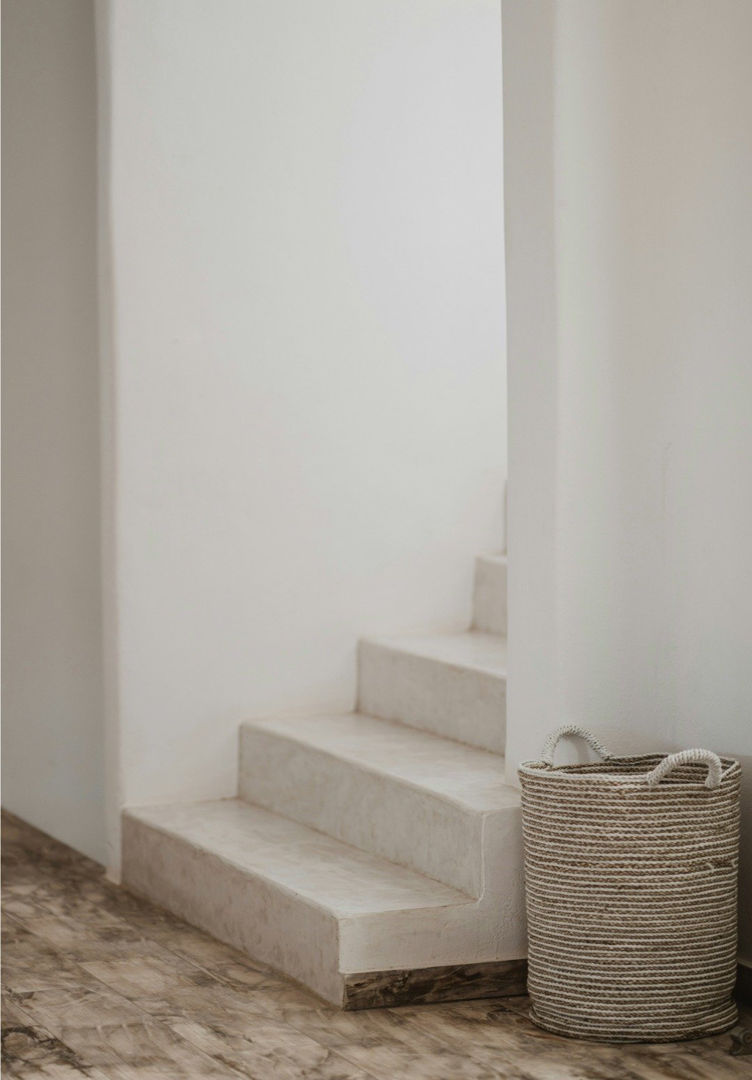 White stone stairs with a basket on the side for styling a website of Bend Oregon Real Estate Agent for Northwest Crossing.