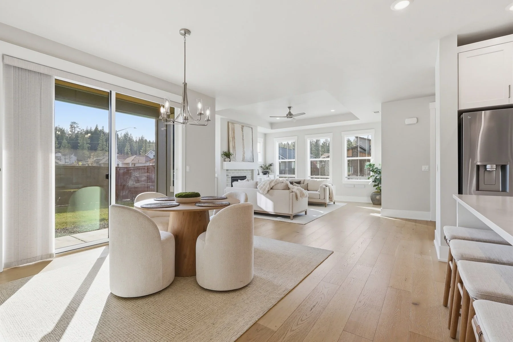 Bright, open concept dining room and living room for a Bend Oregon Real Estate listing by The Ortega Collective.