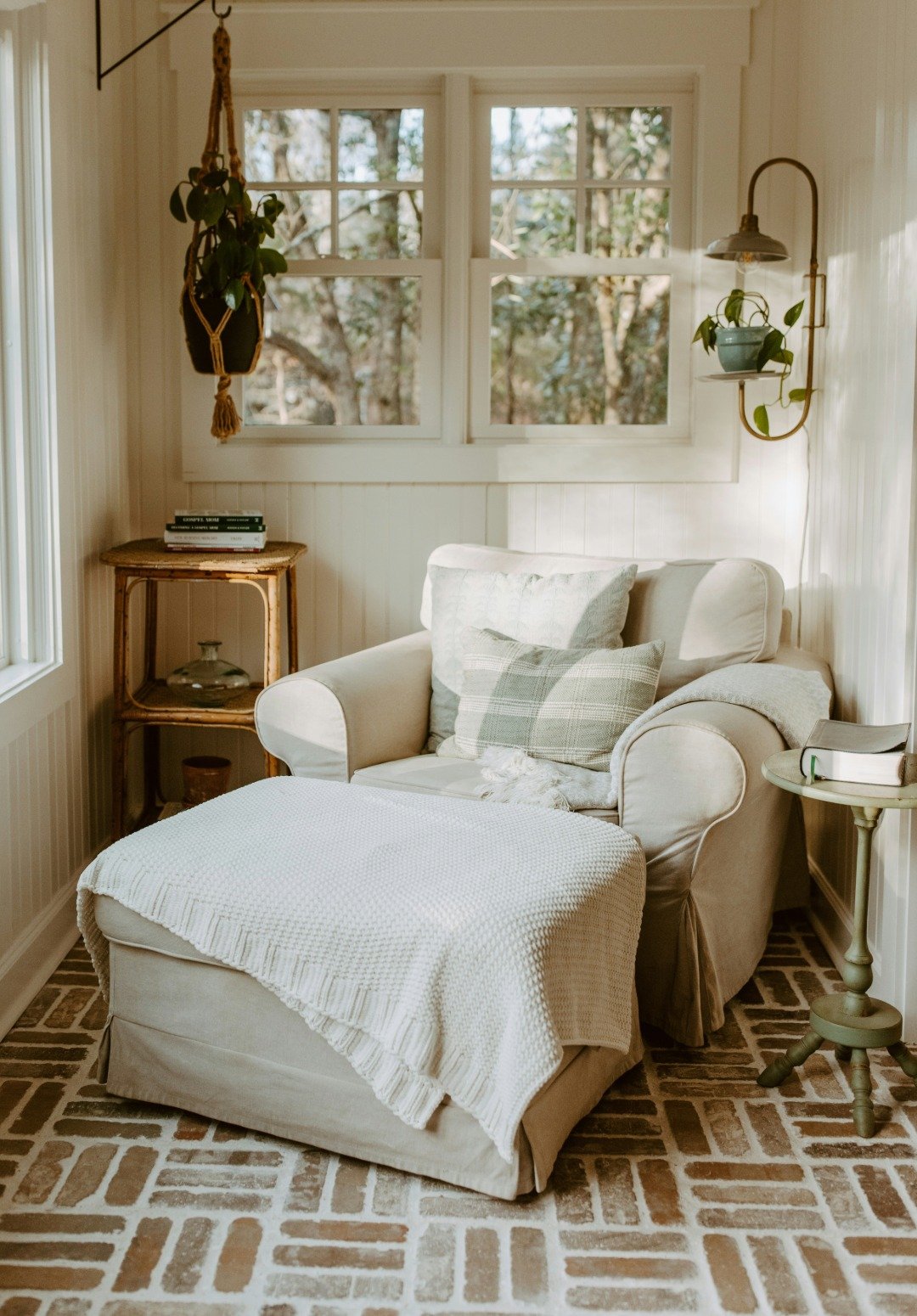 A cozy living room corner with a cream-colored armchair for Bend Northwest Crossing Real Estate Agency website photos.