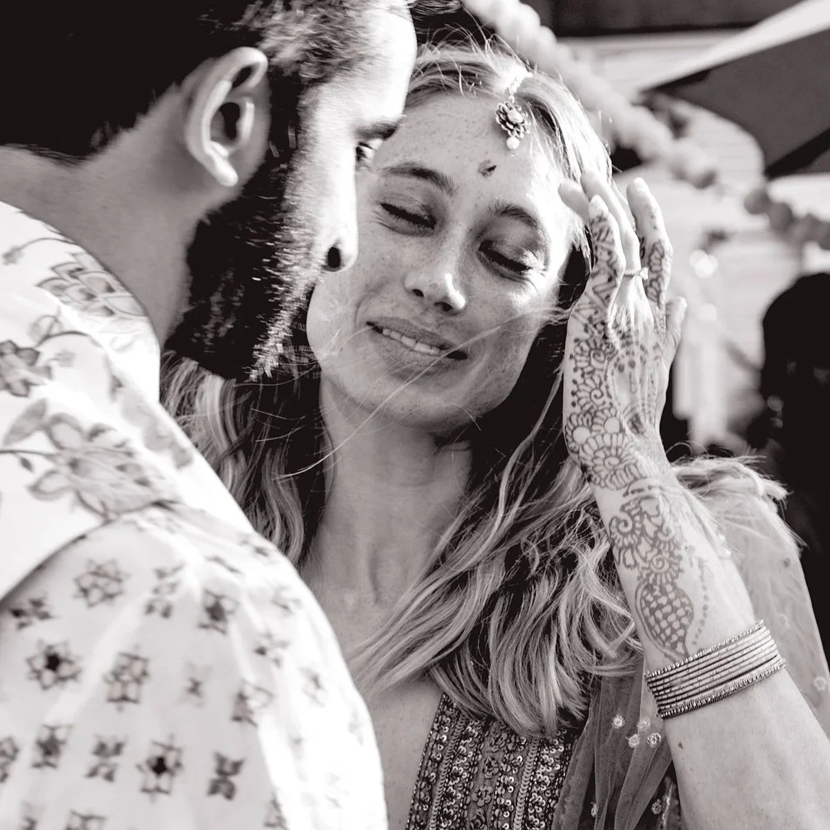 Couple sharing a quiet moment during a wedding rehearsal dinner on California's Central Coast