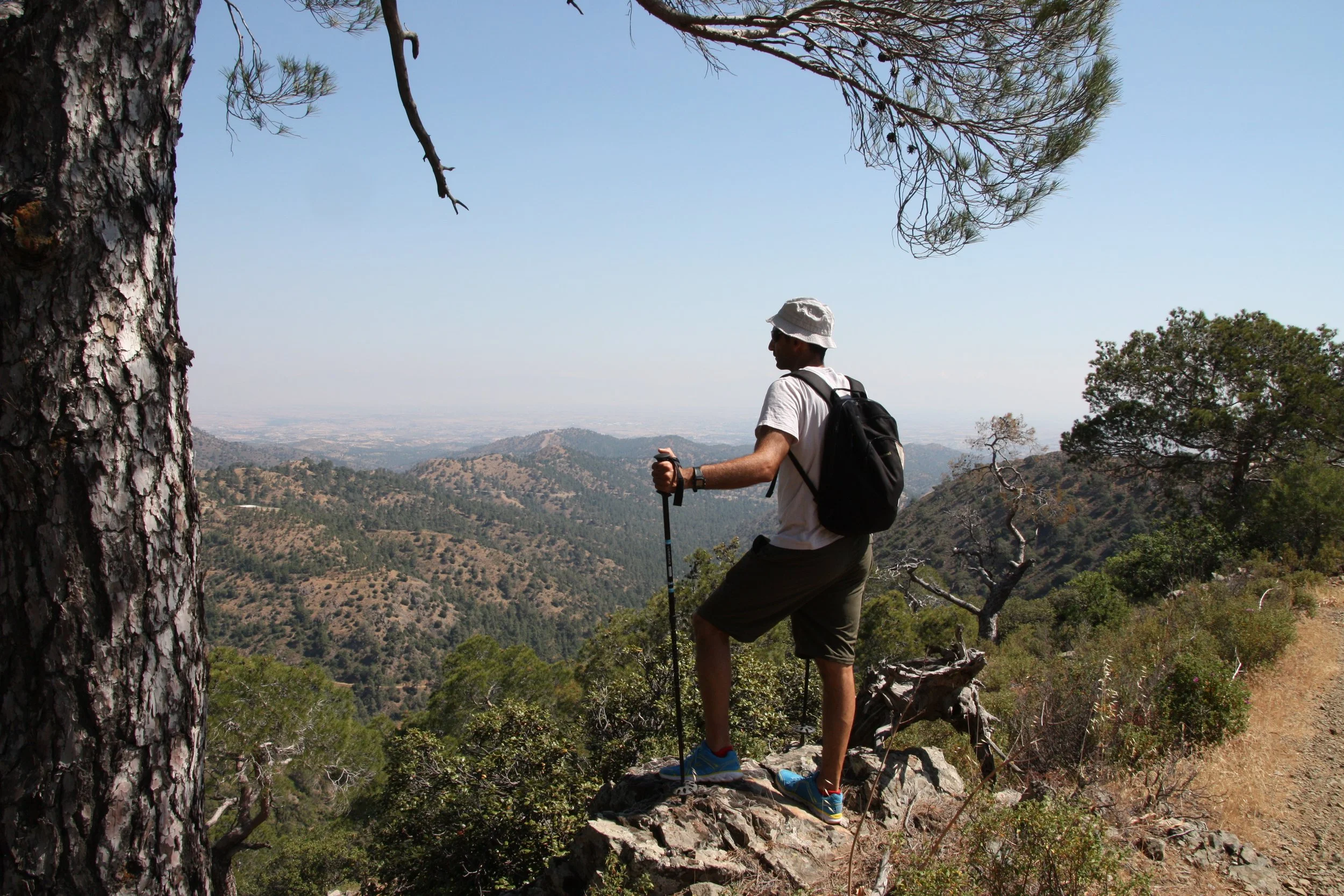 Man standing on a ridge in the mountains