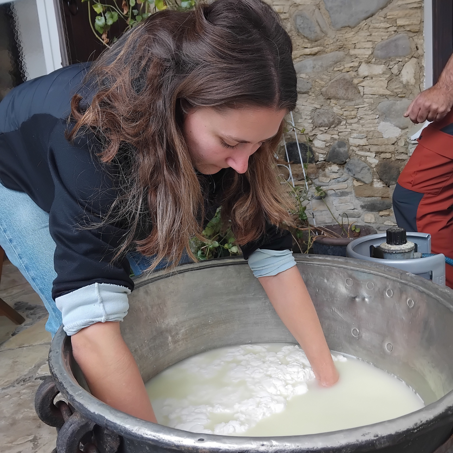 Girl making halloumi by hand