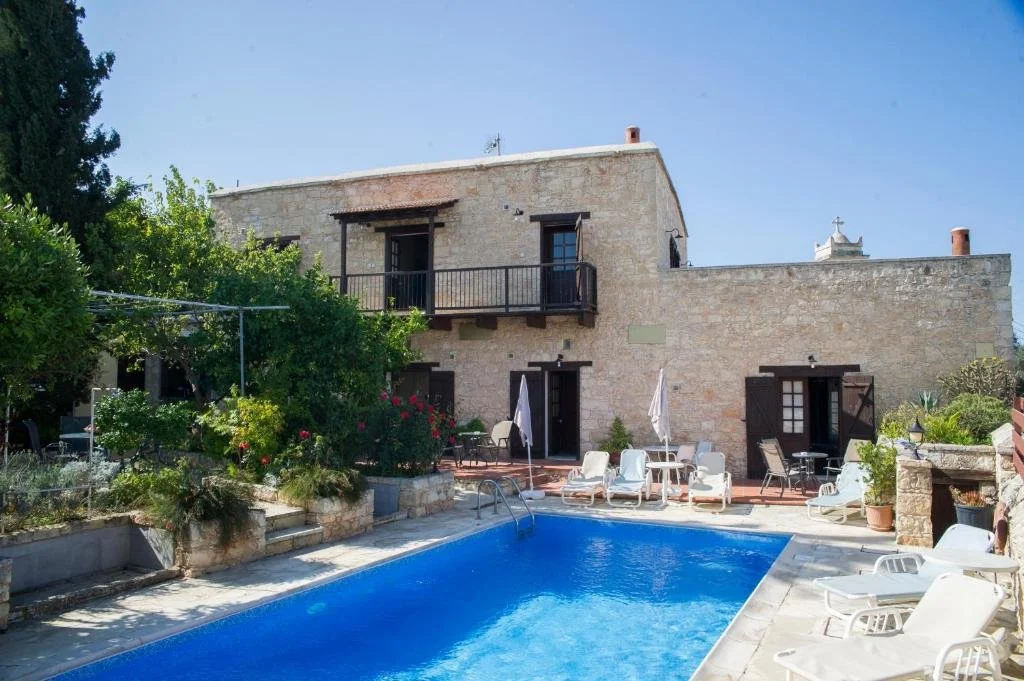 traditional stone building with a pool