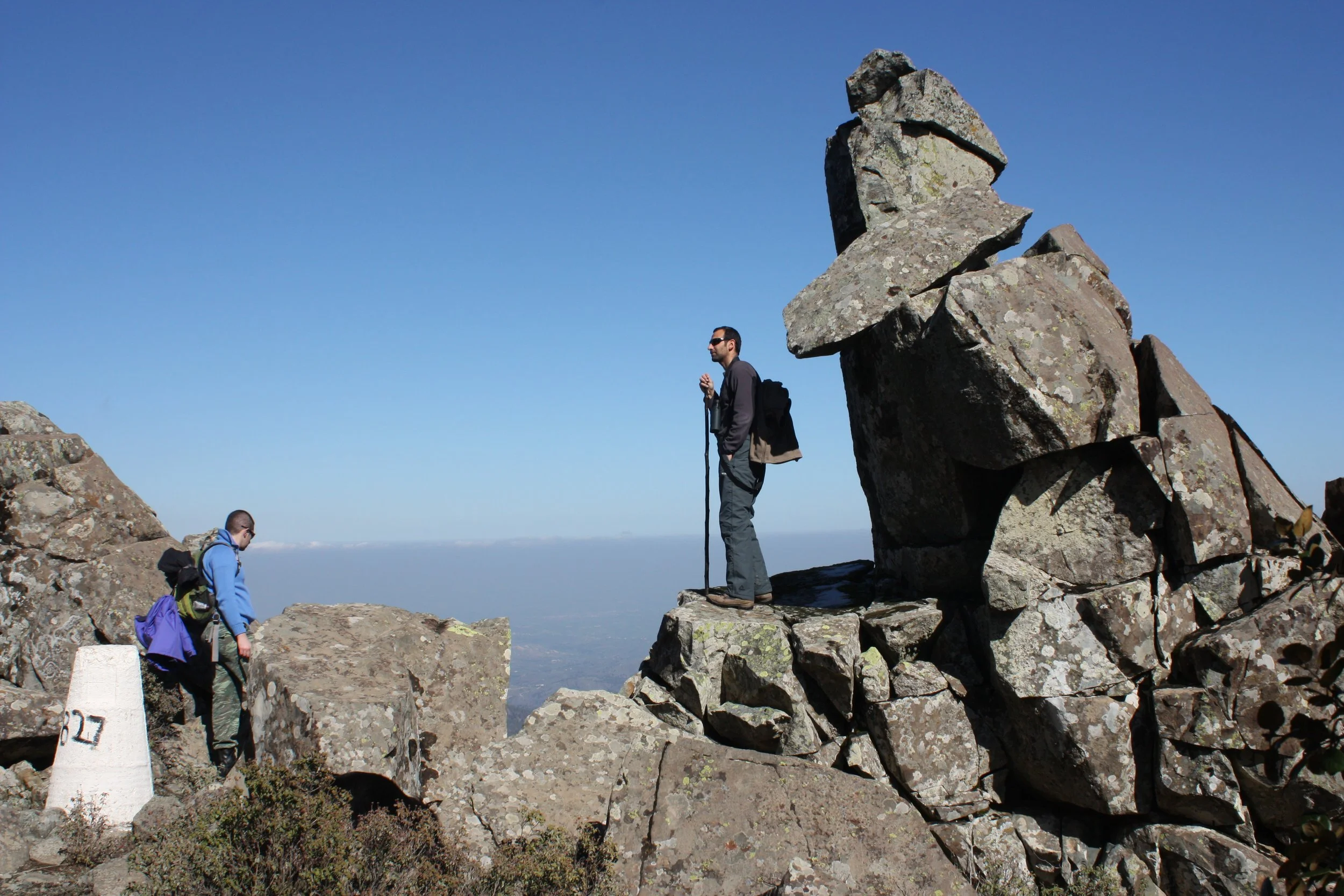 Two people hiking at the top of the mountains