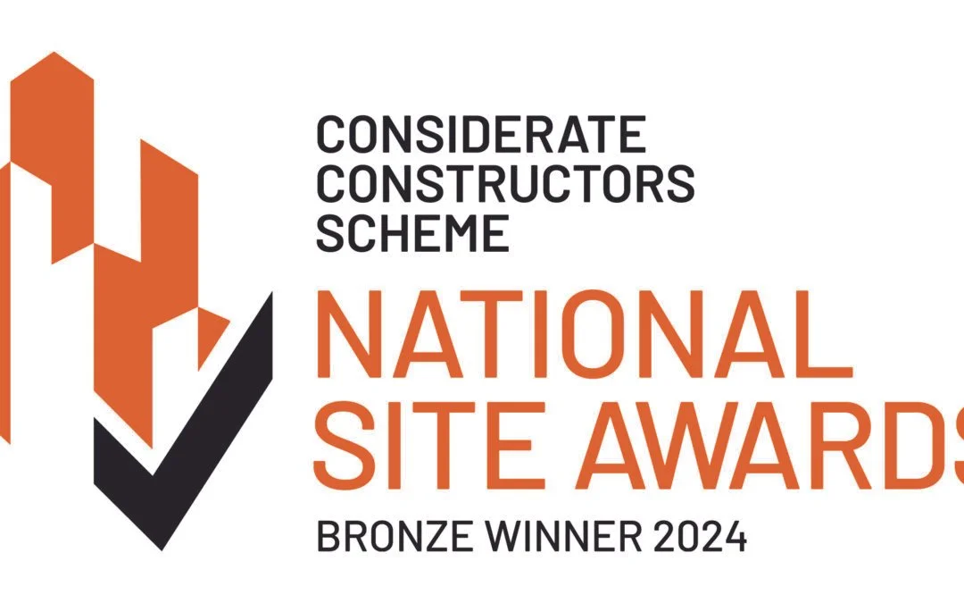 A graphic award badge for the 2024 Considerate Constructors Scheme National Site Awards, indicating a bronze winner, with a styled checkmark logo.