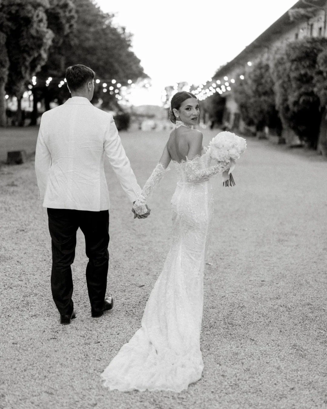 Some wedding days stay with you long after they are over.
Not because of a single moment, but because of the atmosphere created by every detail.
The candlelit tables. The summer evening light. The architecture, the garden, the feeling of moving throu