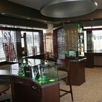 Display cases with jewelry and watches inside a well-lit store