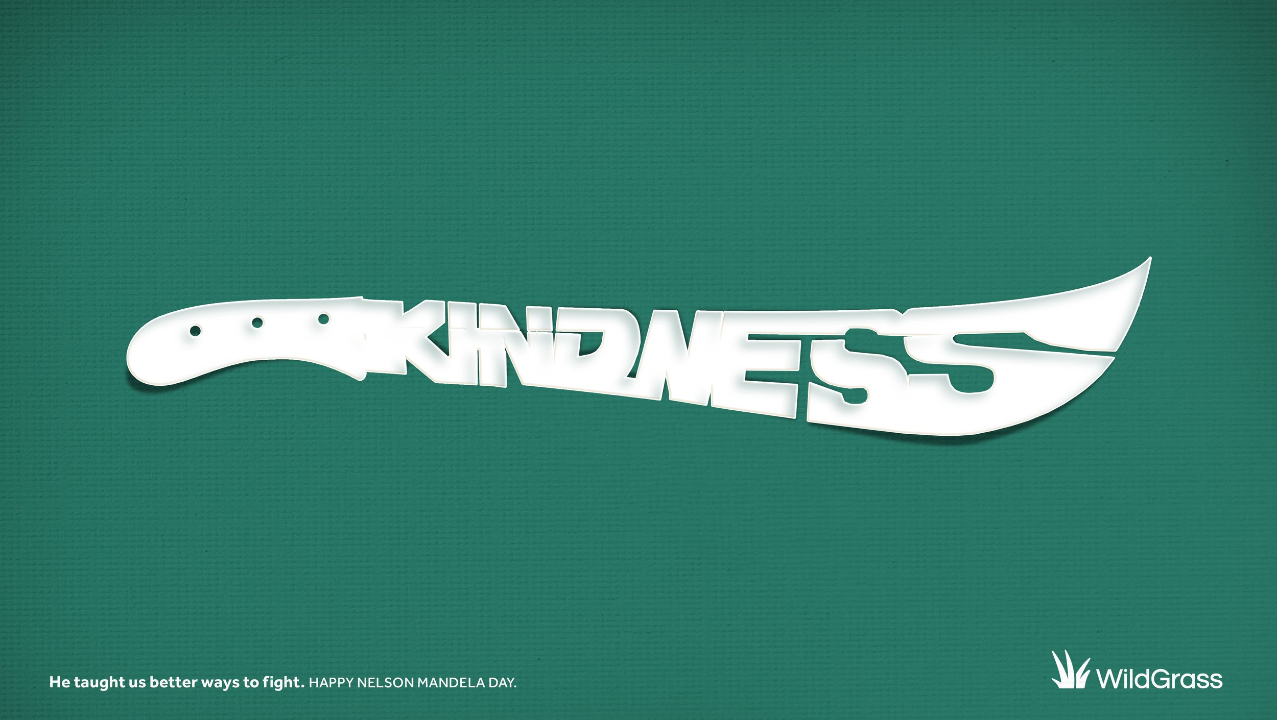 White knife-shaped cutout with the word "KINDNESS" cut out inside it, placed on a green background.