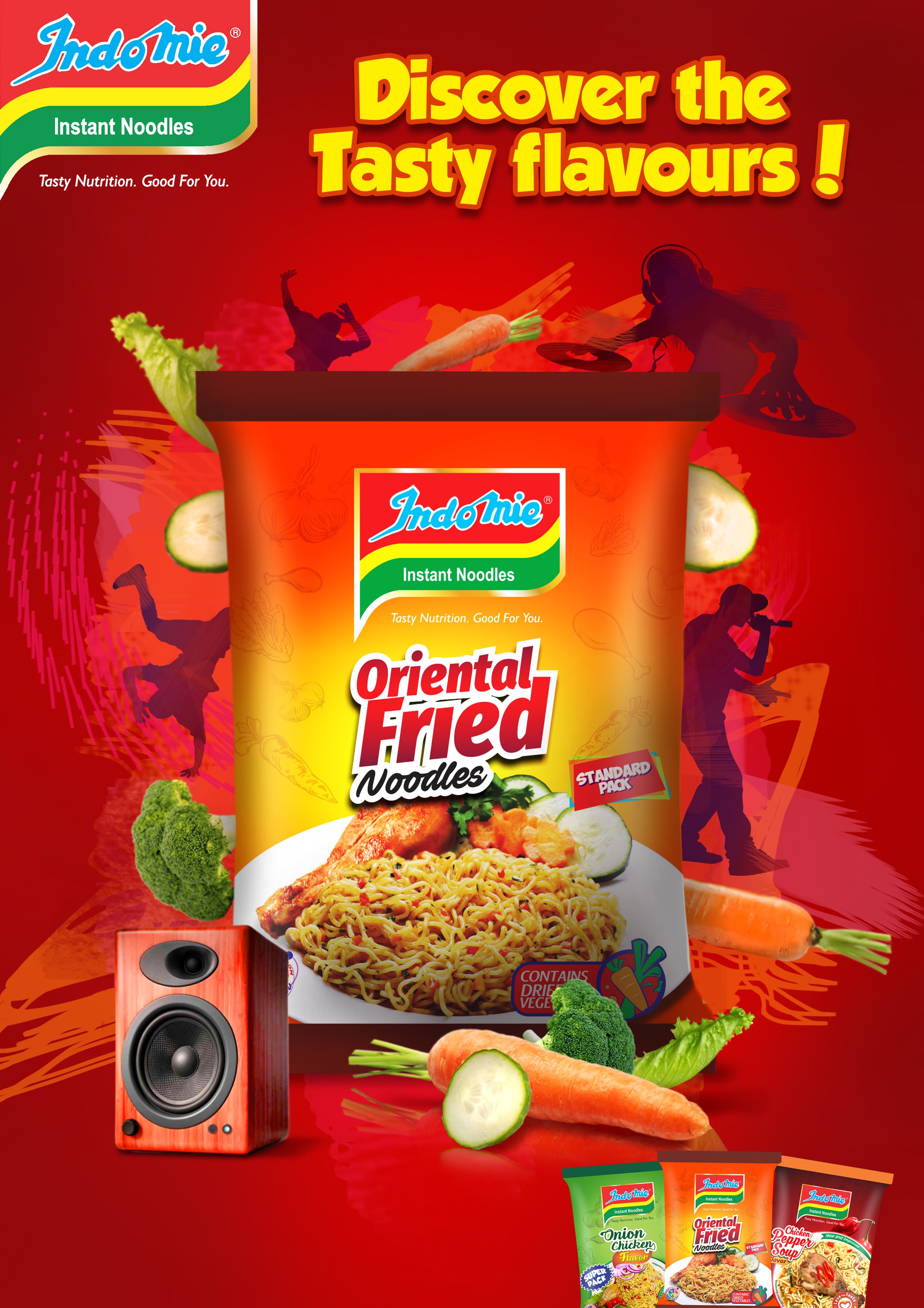 A colorful advertisement for Indomie instant noodles with the slogan "Discover the Tasty Flavours!" It features a cup of Oriental Fried Noodles with a plate of cooked noodles, vegetables, and a drum speaker, surrounded by vegetables like carrots, bro