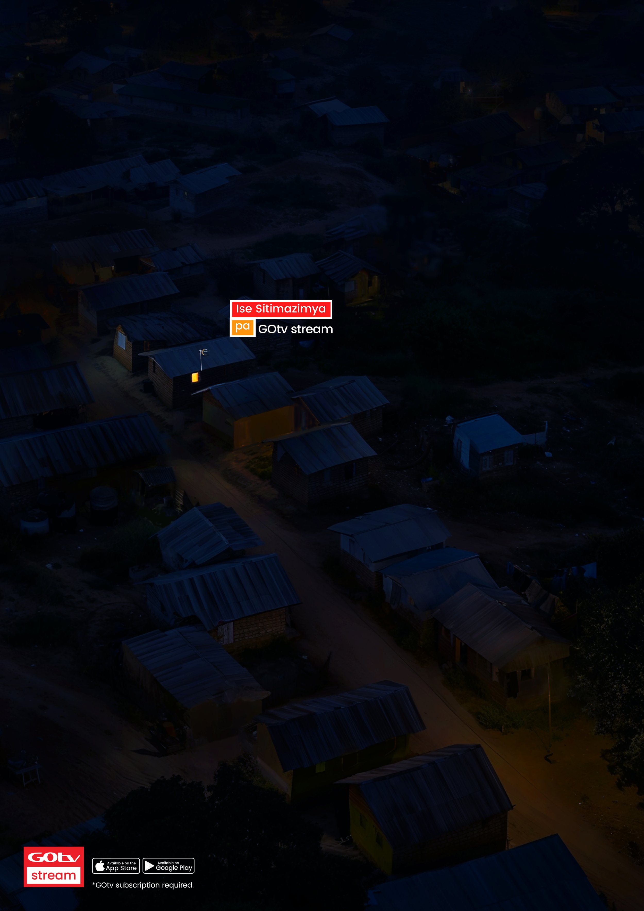 Nighttime aerial view of a small village with scattered houses and a dirt road. Some houses have faintly visible lights. There is a logo and text in the lower left corner indicating a streaming service advertisement.