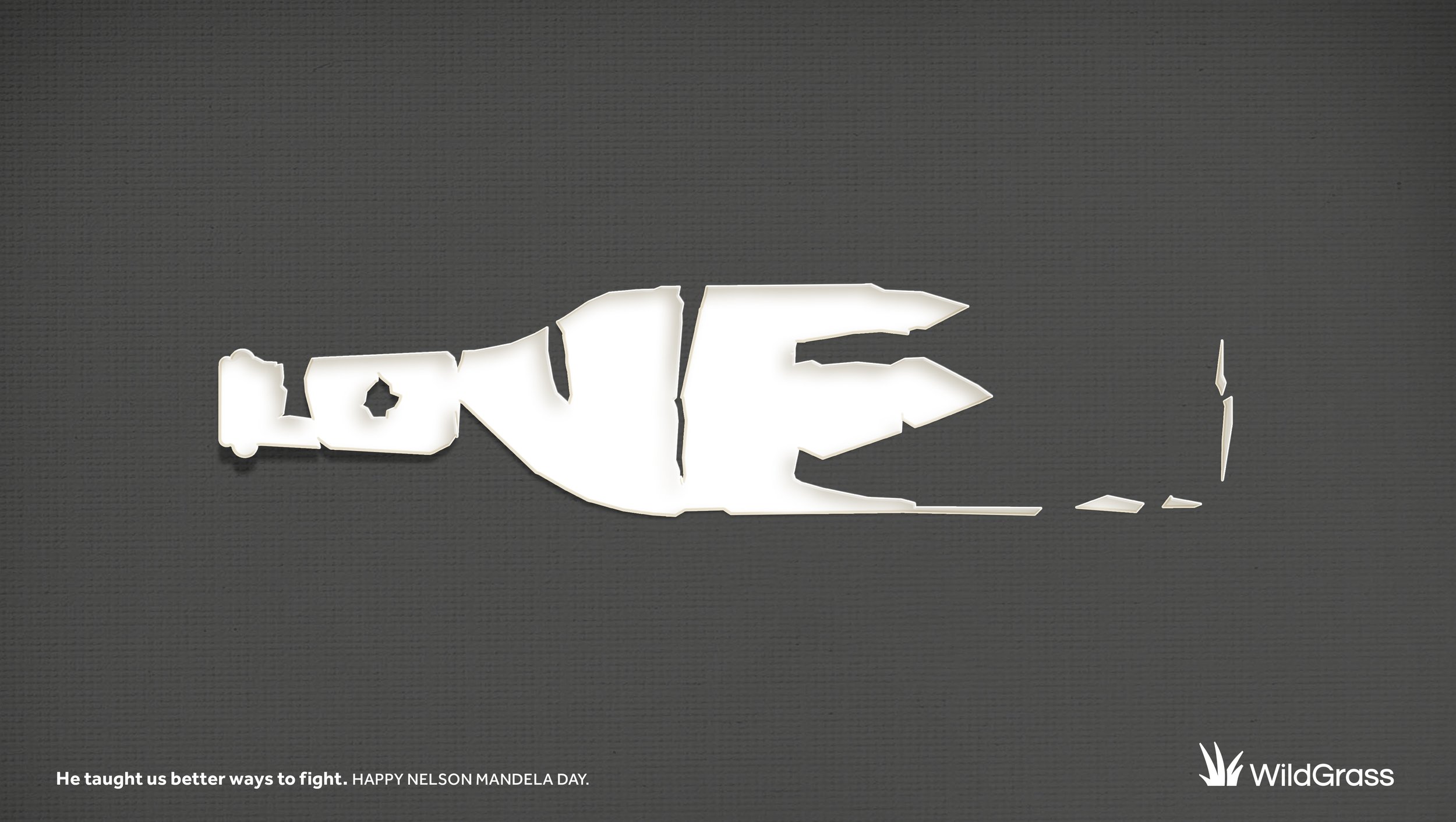 Decorative white cutout spelling 'LOVE' on a dark background, with a quote at the bottom reading 'He taught us better ways to fight. HAPPY NELSON MANDELA DAY.' and a WildGrass logo in the bottom right corner.