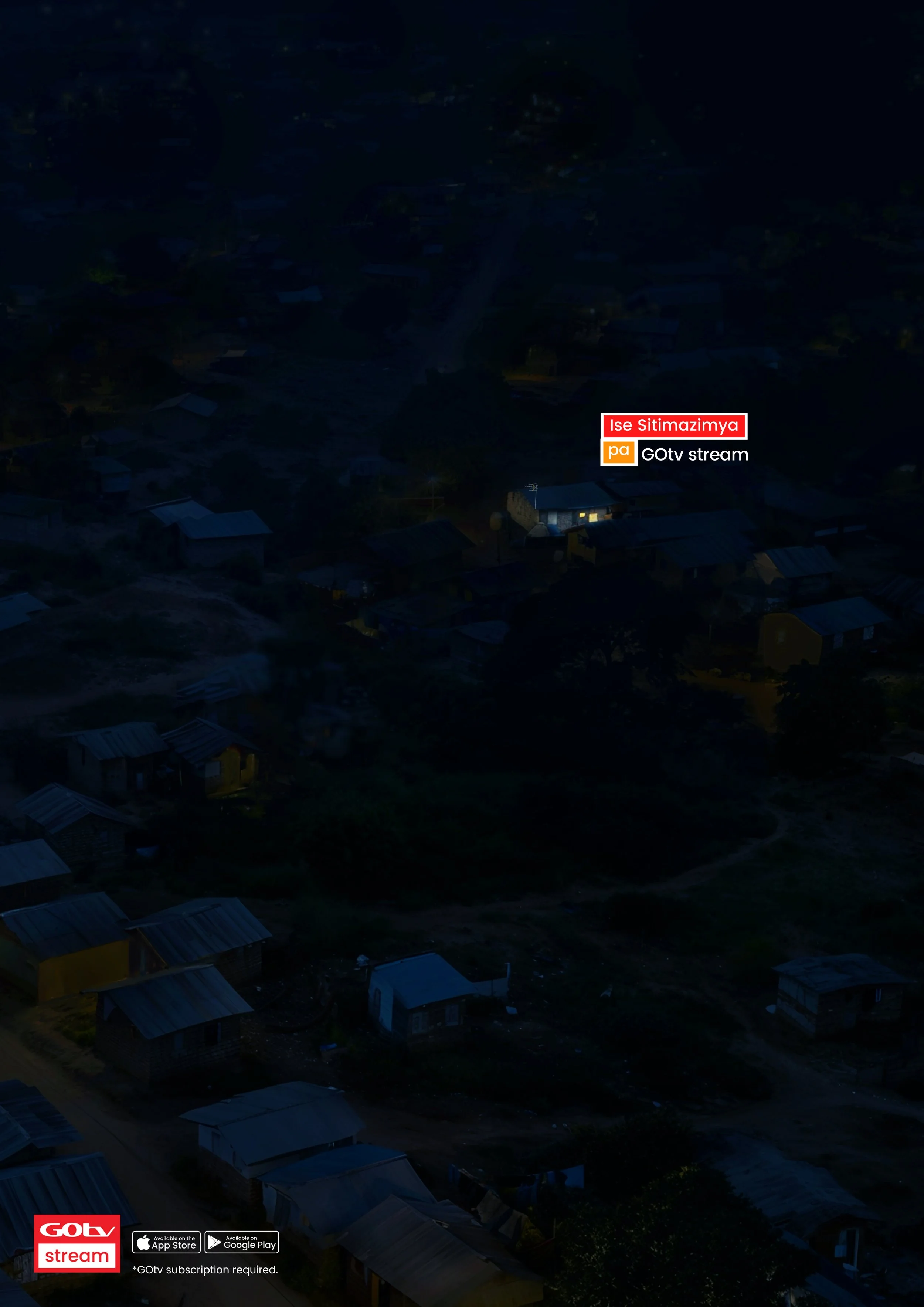 Dark aerial view of a small town or neighborhood with scattered houses and buildings. There is a label in the lower right corner reading 'GOVt stream' with app store icons and a note about subscription.