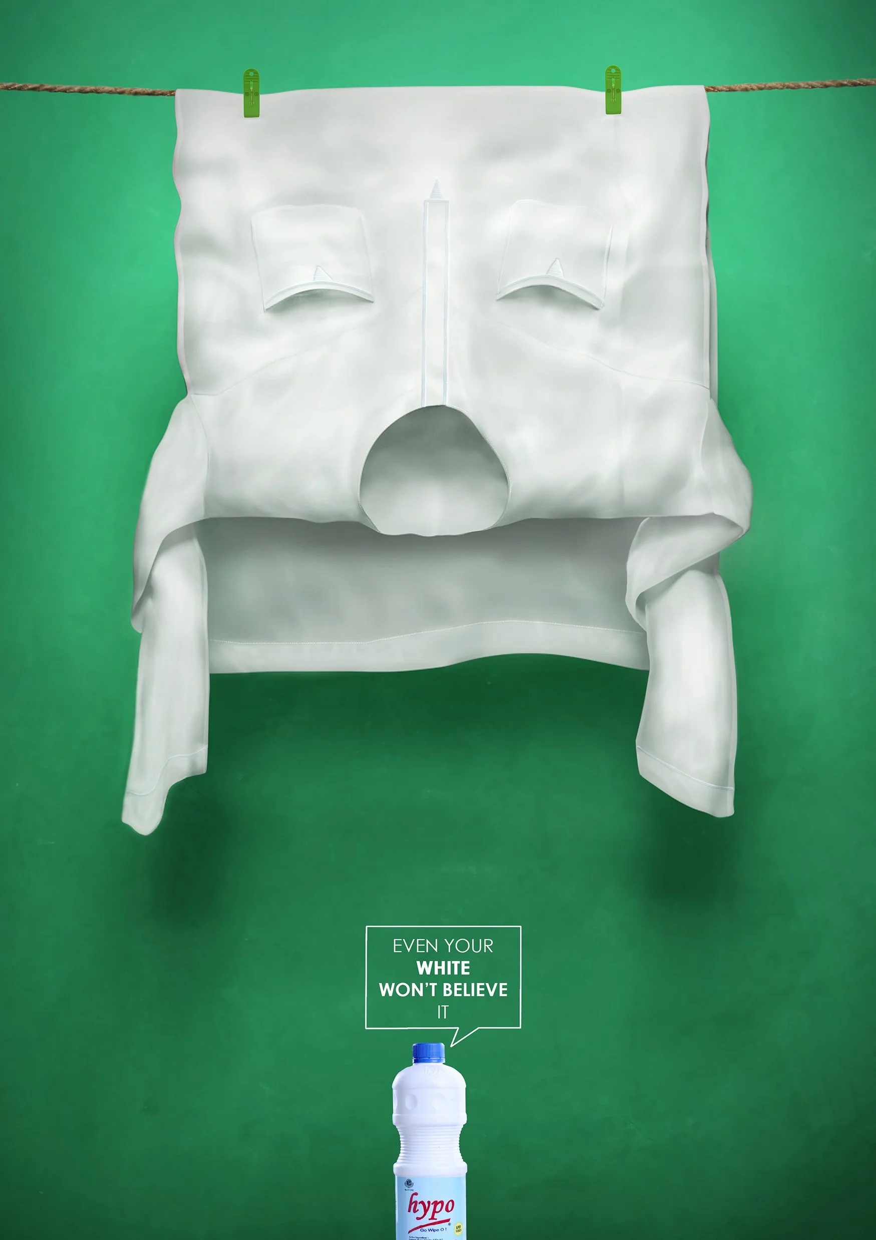 A white face mask hanging on a clothesline with green clips against a green background, with a bottle of hypo Wipes below and a caption that reads, 'Even your white won’t believe it.'