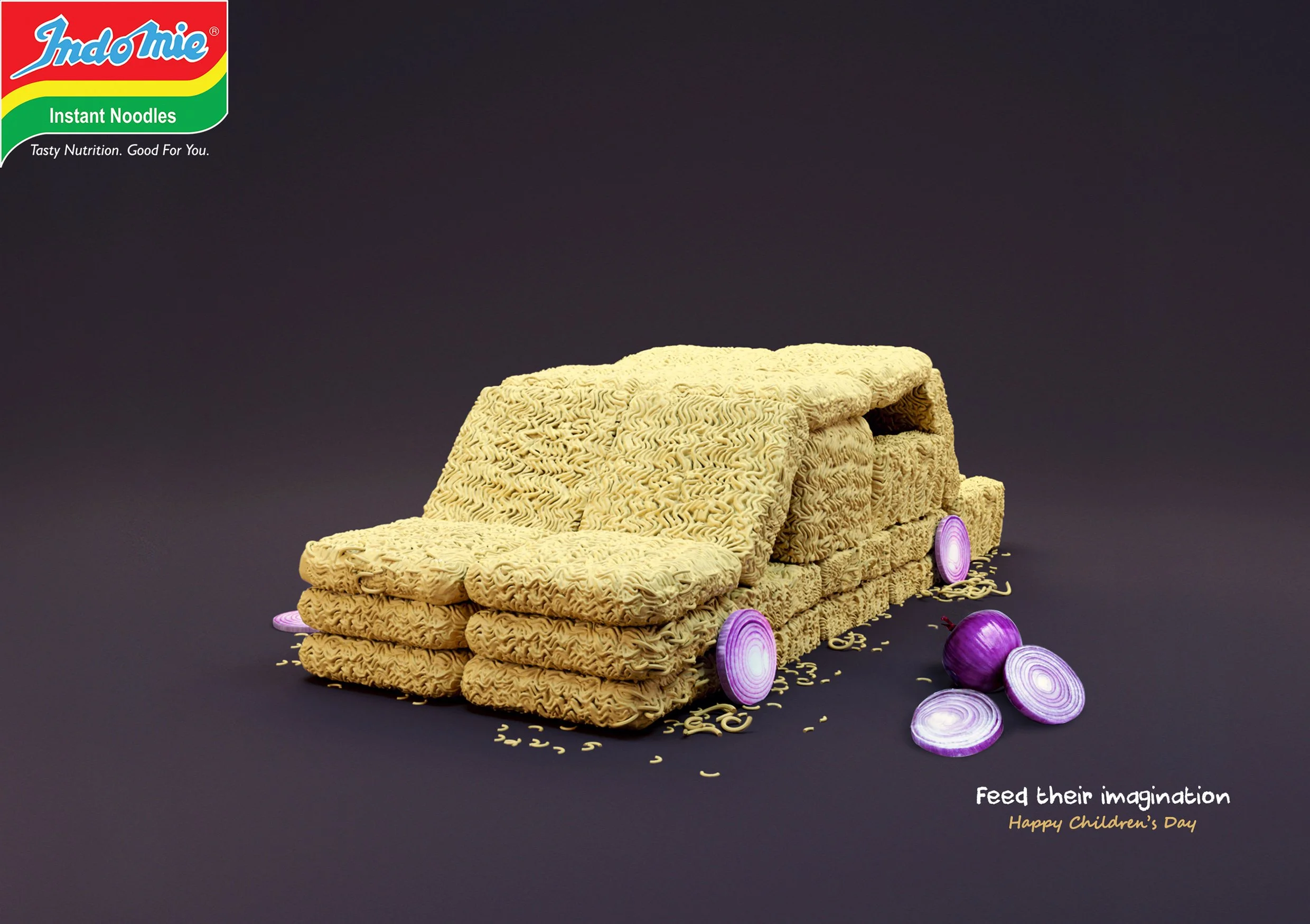 A creative food art piece featuring noodles arranged to resemble a couch, with purple onion slices used as decorative accents, and the text 'Feed their imagination. Happy Children's Day' in the bottom right corner.