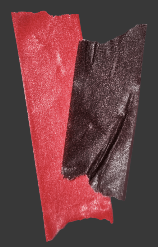 Close-up of torn red and black textured paper or fabric.