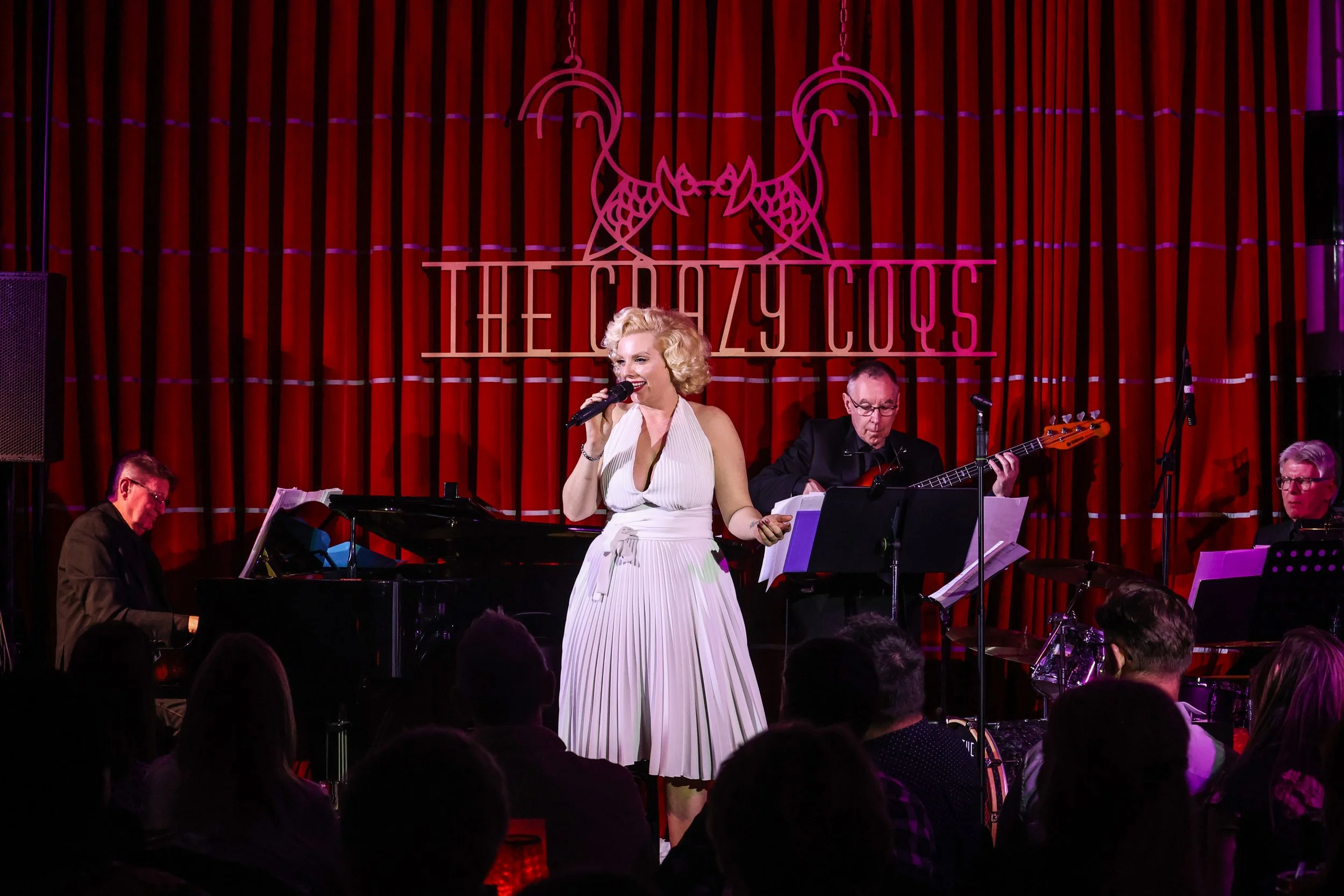 Marilyn Monroe tribute artist Isabella Bliss performing live with a band during One Night With Marilyn