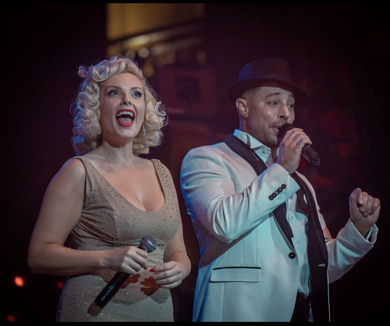 Marilyn Monroe tribute artist Isabella Bliss performing on stage with Duncan James from Blue during a live show
