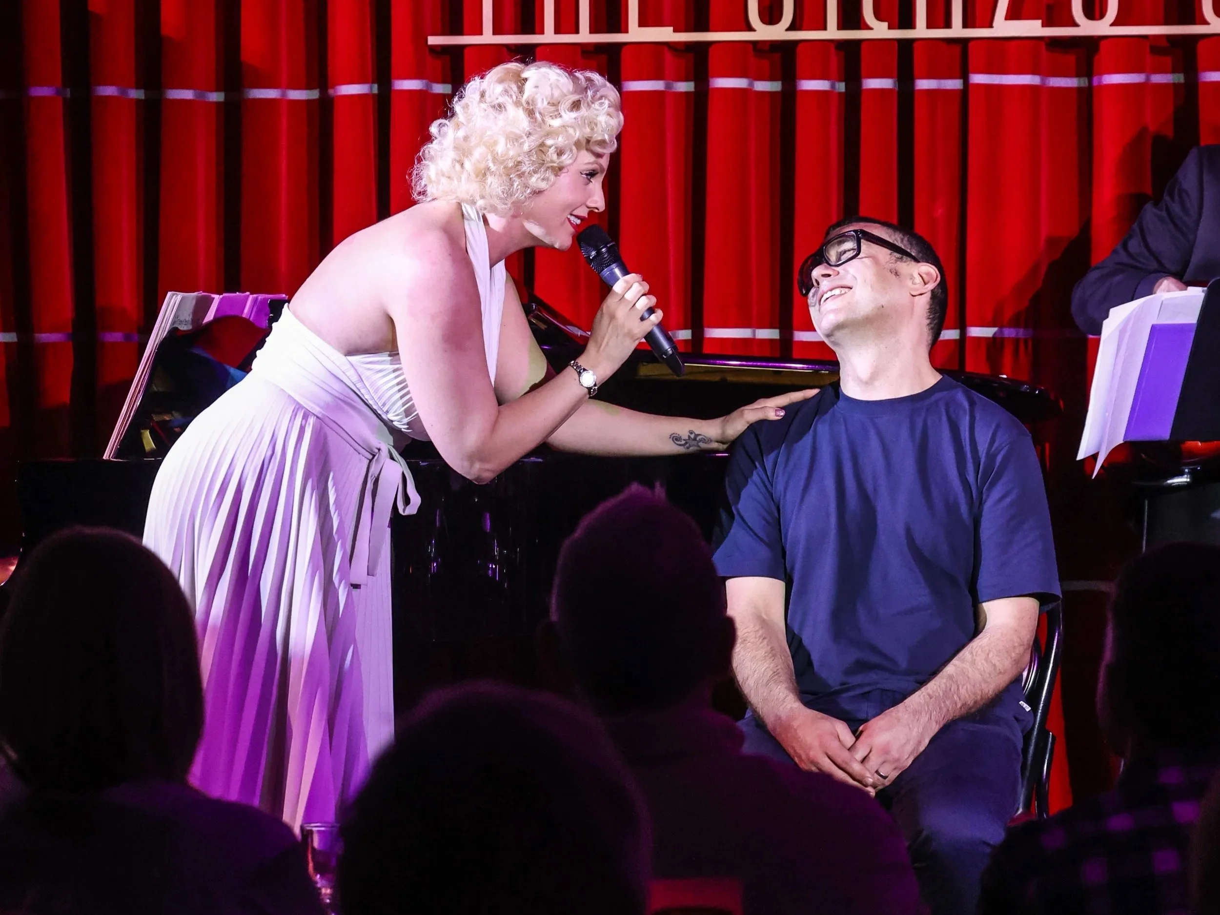 Marilyn Monroe tribute artist Isabella Bliss interacting with an audience member during a live performance