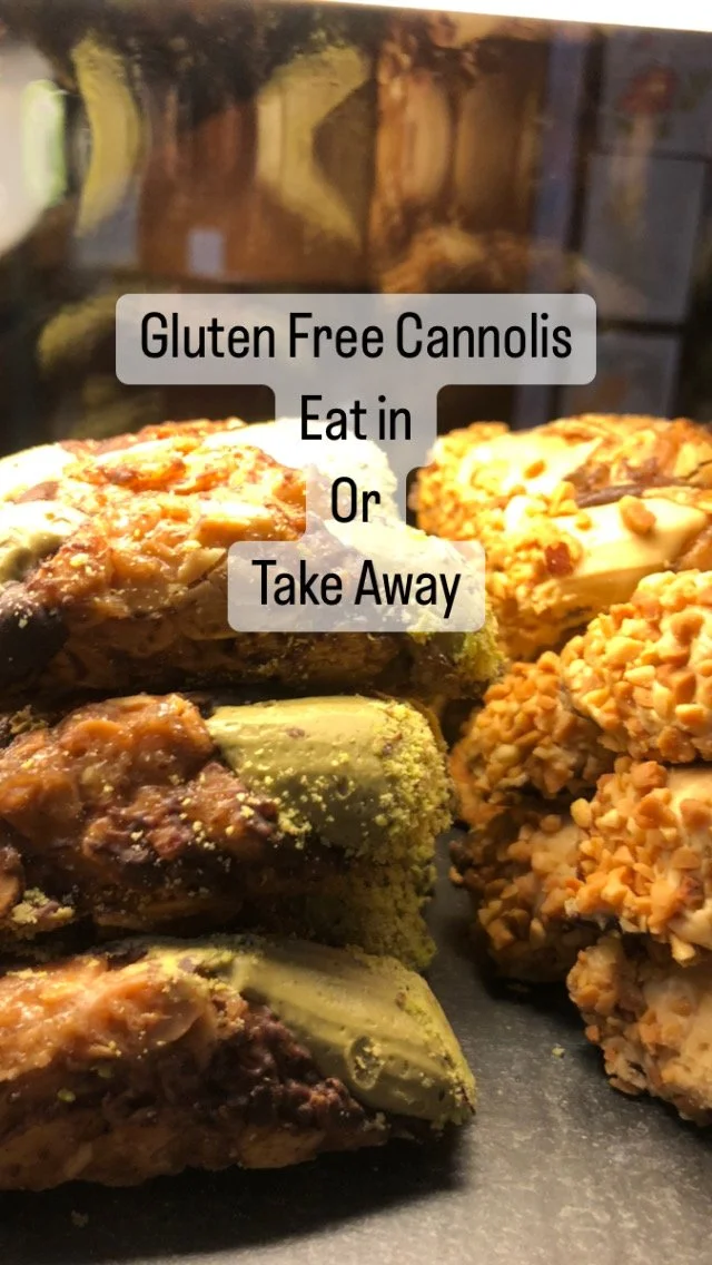 Close-up of gluten-free cannolis with a text overlay that says 'Gluten Free Cannolis Eat in Or Take Away'.