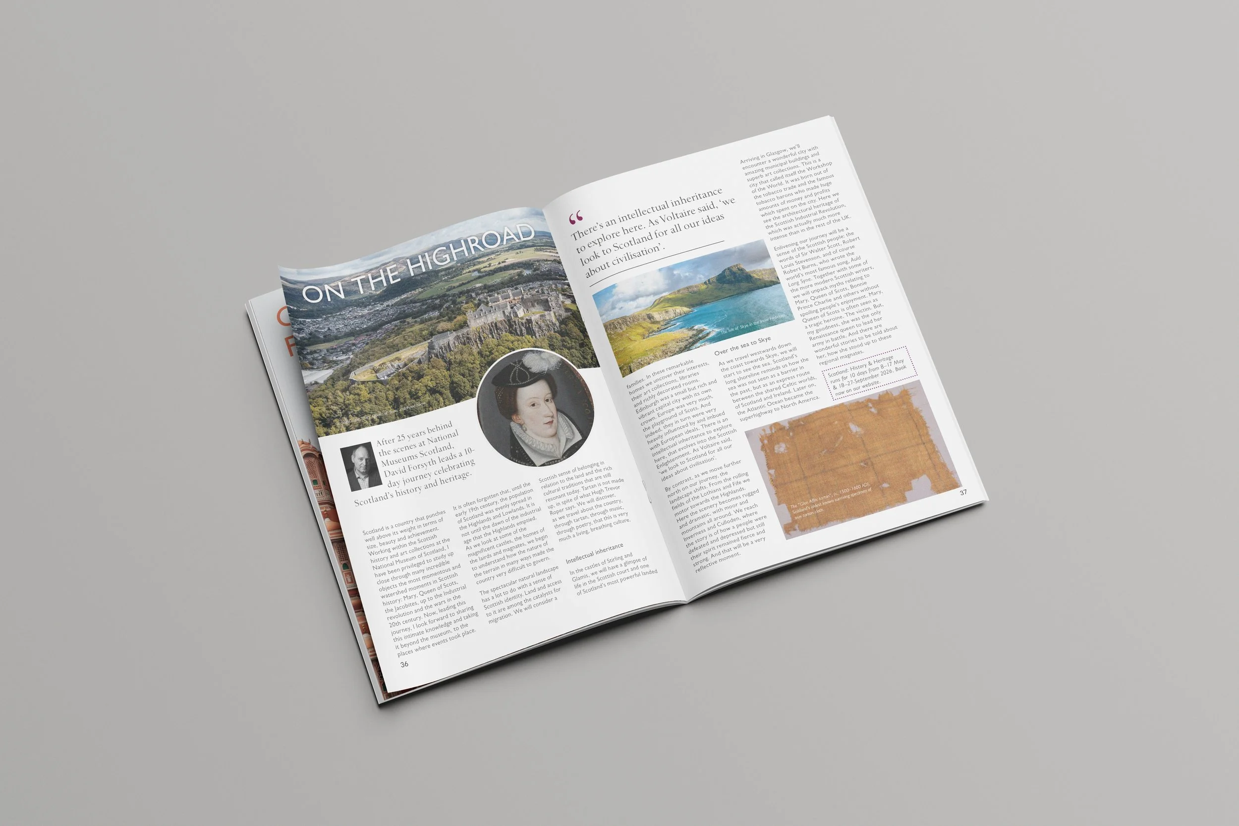 Open magazine on a gray surface, showing pages with text, images of landscape, a portrait of a woman, and a section with orange background and some text.