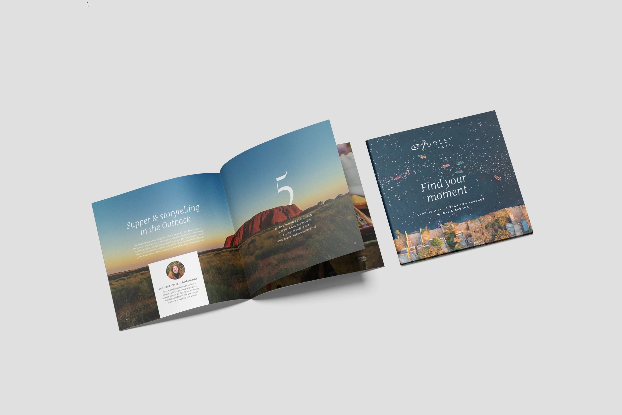 Brochure or magazine featuring travel destinations, with images of a mountain landscape at sunset on the left page and cityscape at night on the right page.