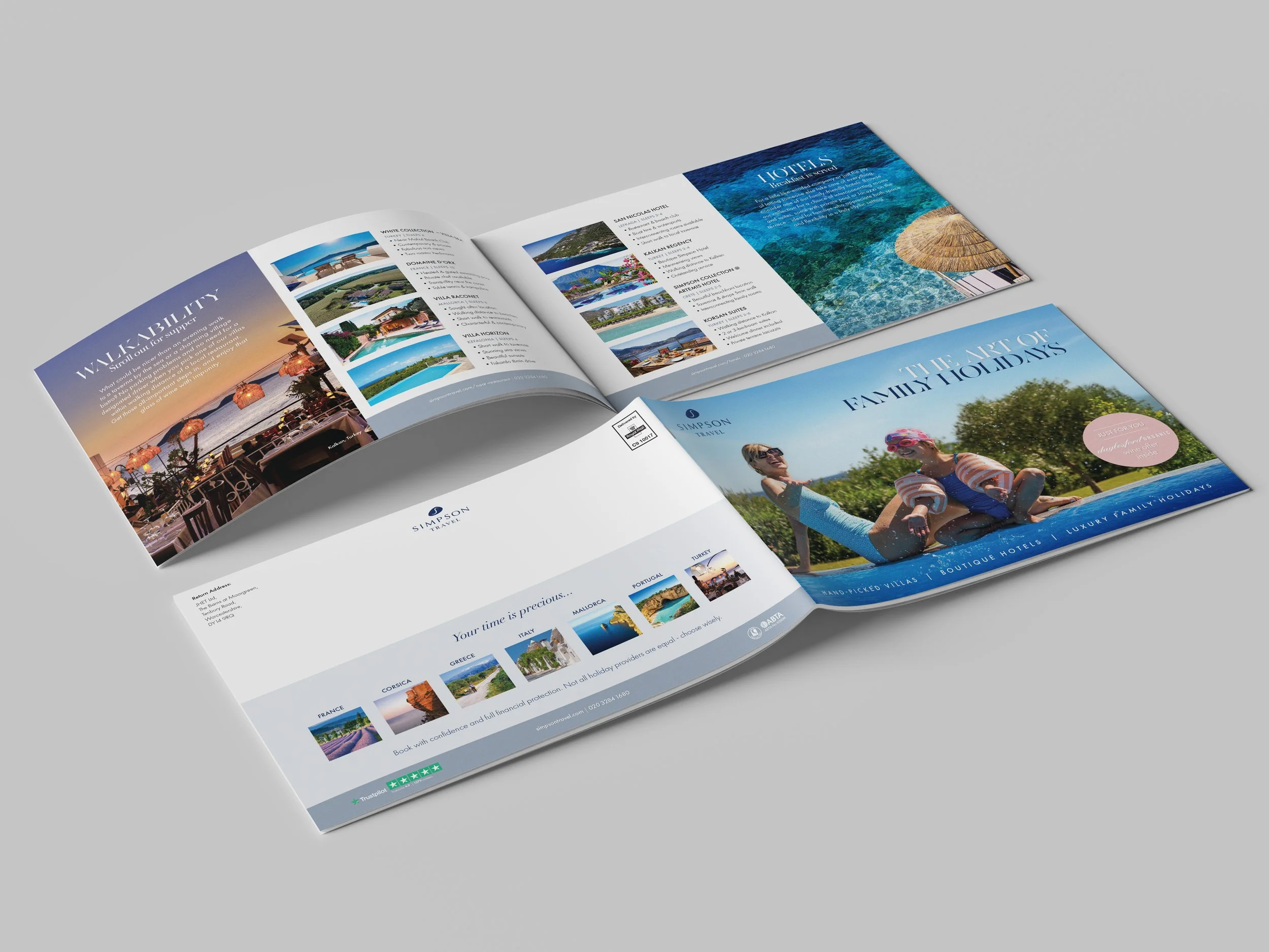 Open travel brochure displaying various hotel options, scenic photos, and vacation destinations.