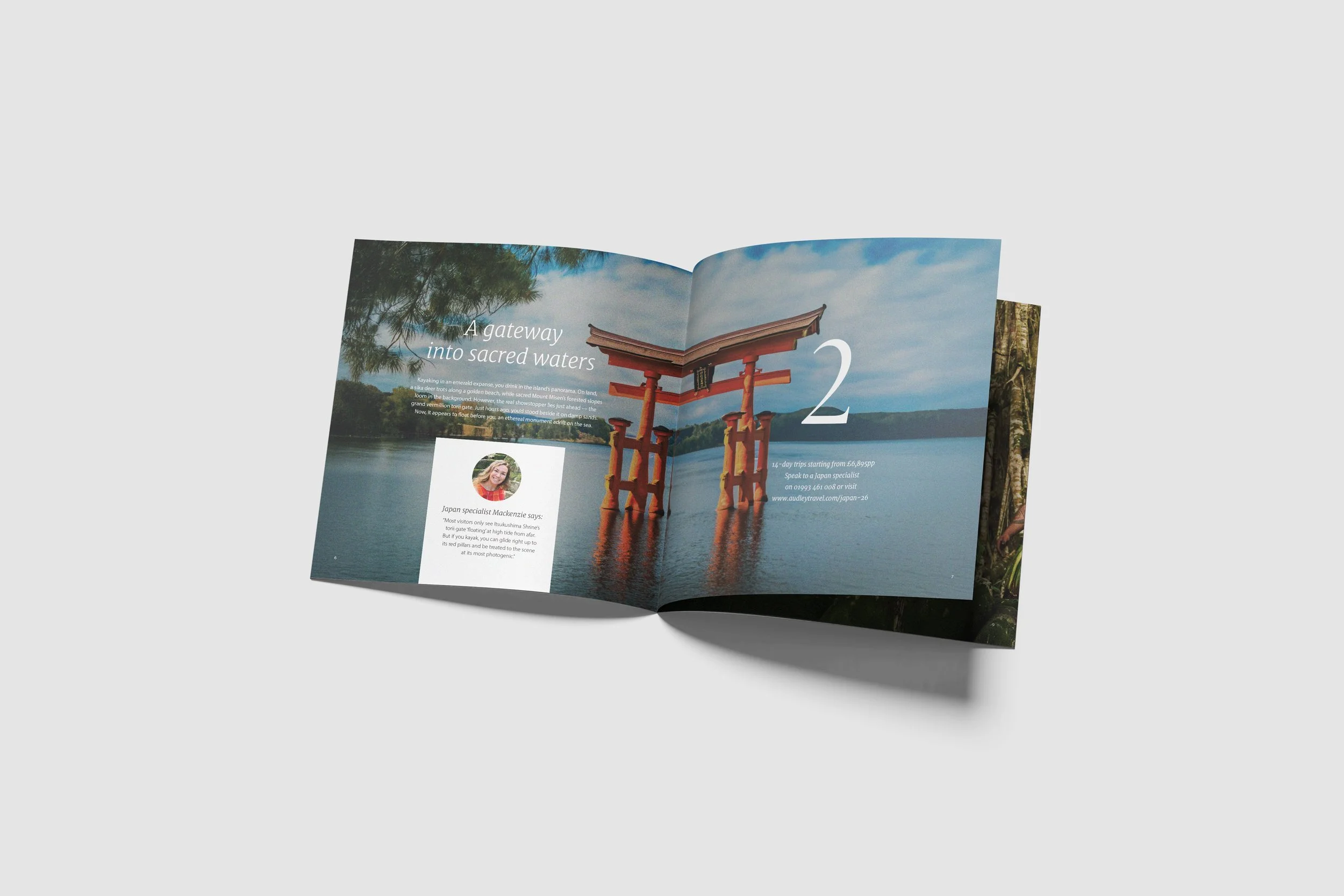 An open travel brochure featuring a scenic water view with a traditional Japanese torii gate partially submerged in water, with trees and distant mountains in the background.