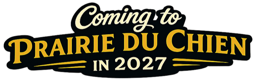 Text on a black background that says, 'Coming to Prairie du Chien in 2027' in yellow and white font.