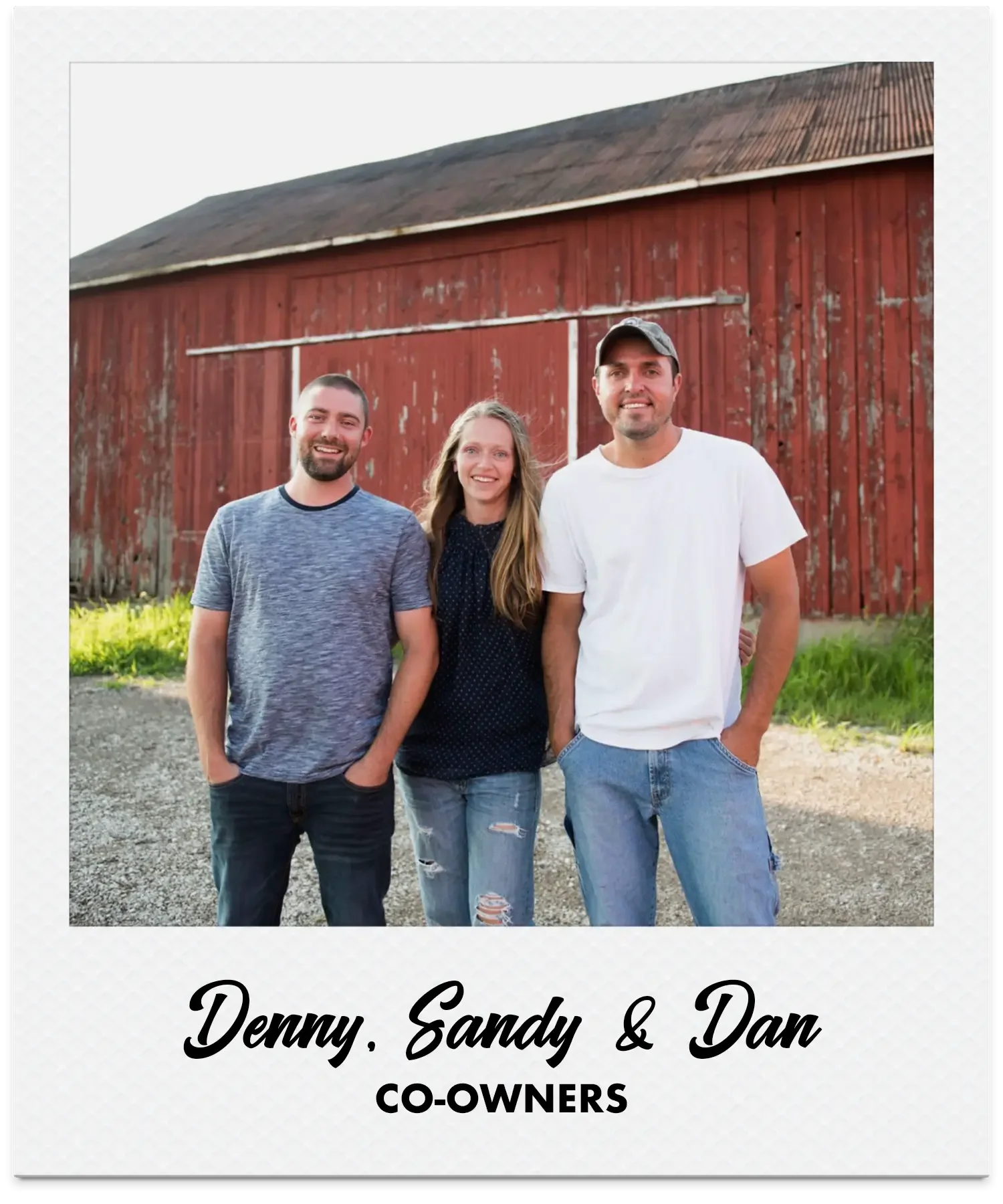 Three people standing outdoors in front of a brewery in Southwestern Ontario. The group includes two men with short hair and a woman with long hair. They are smiling and dressed casually. The image has text: 'Denny, Sandy & Dan, Co-owners.'