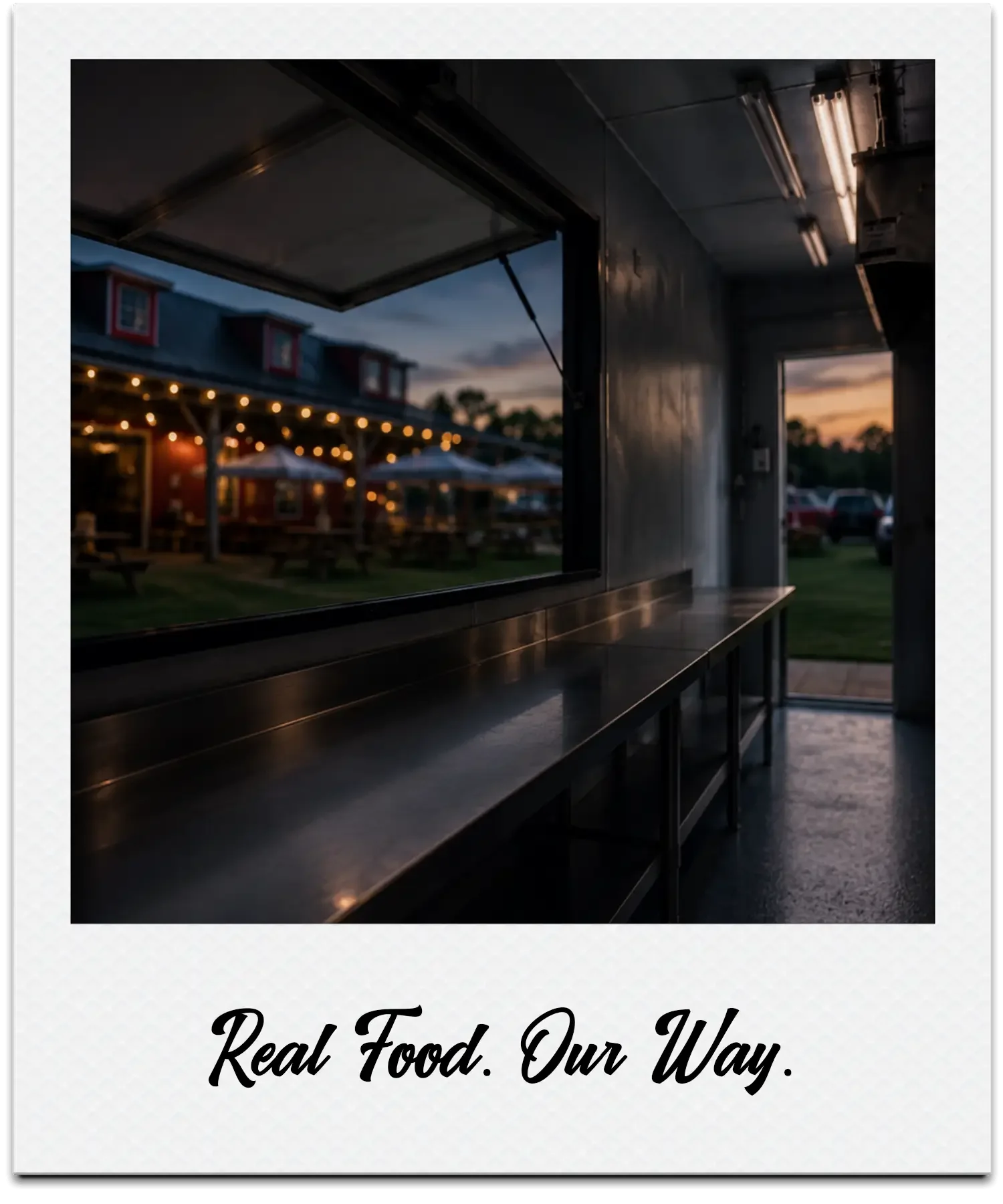 The image shows a view from inside Chatham restaurant in a food truck, looking out toward an outdoor seating area with string lights and umbrellas at sunset. The text overlay reads, 'Real Food. Our Way.'