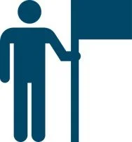 Silhouette of a person using a cane and holding a door open