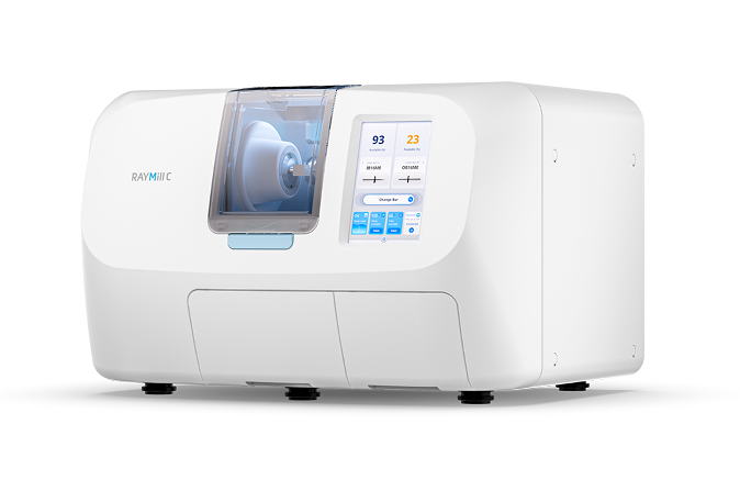 A blood analyzer machine with a digital display, labeled 'RayMiC.'