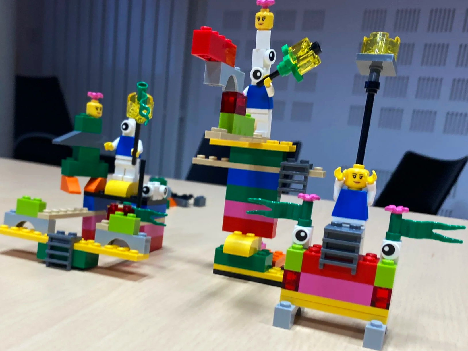Participants using LEGO® SERIOUS PLAY® to make team perspectives visible.