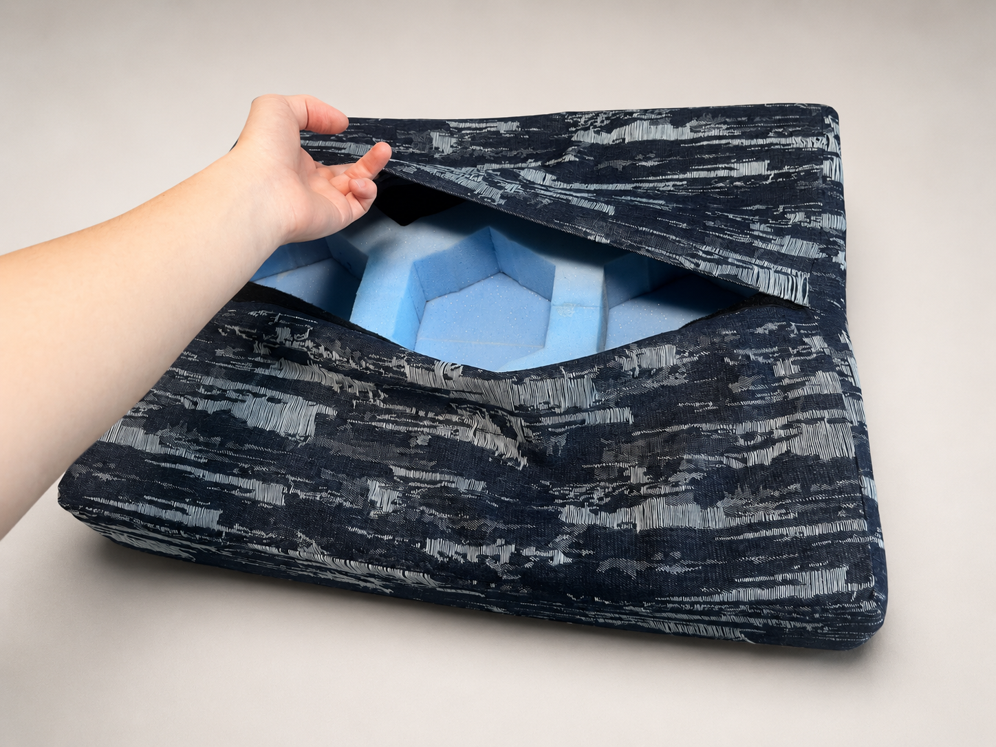 The removable bed cover was manufactured from recycled denim material