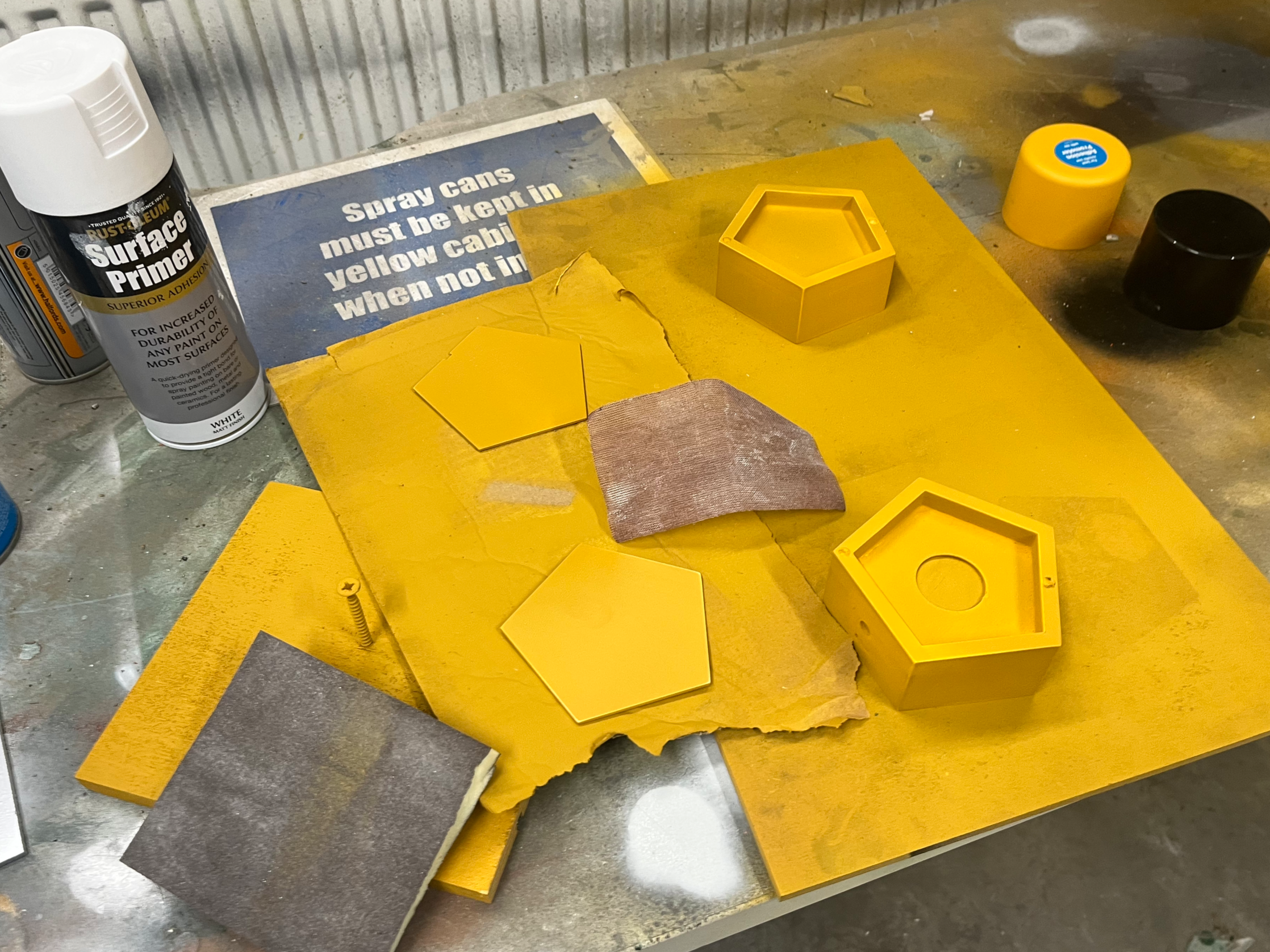 Priming, sanding, and spray painting