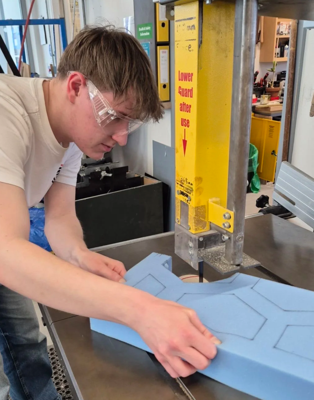 Using a bandsaw to cut the foam into shape
