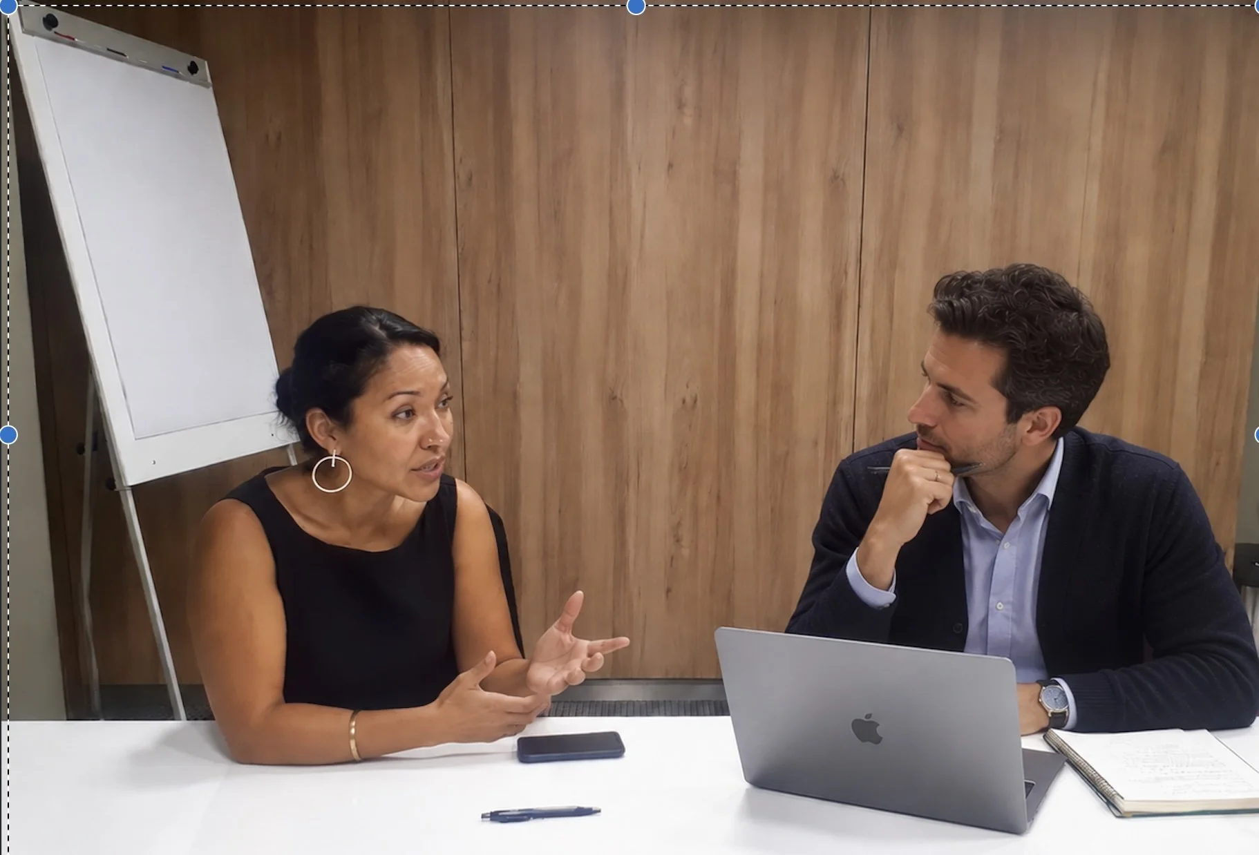 Zully Ortiz in a meeting with a colleague at a conference table