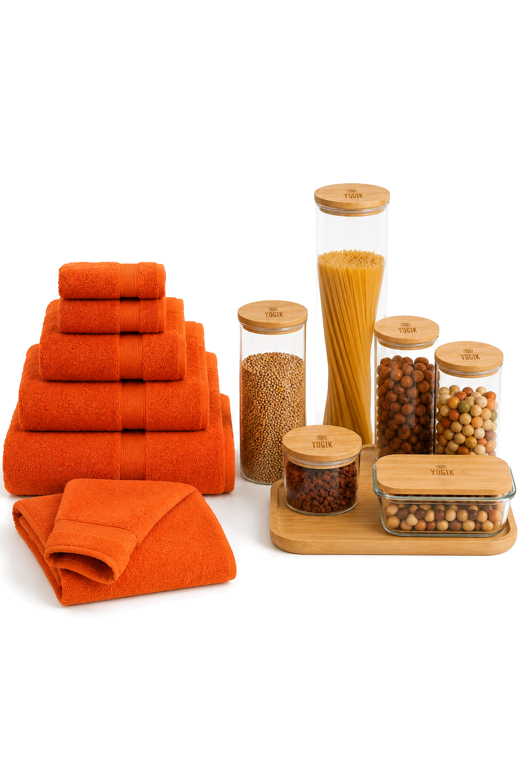 Stack of orange towels and folded orange washcloths next to glass jars filled with pasta, beans, and spices on a wooden tray, with more jars of beans and spices in the background.