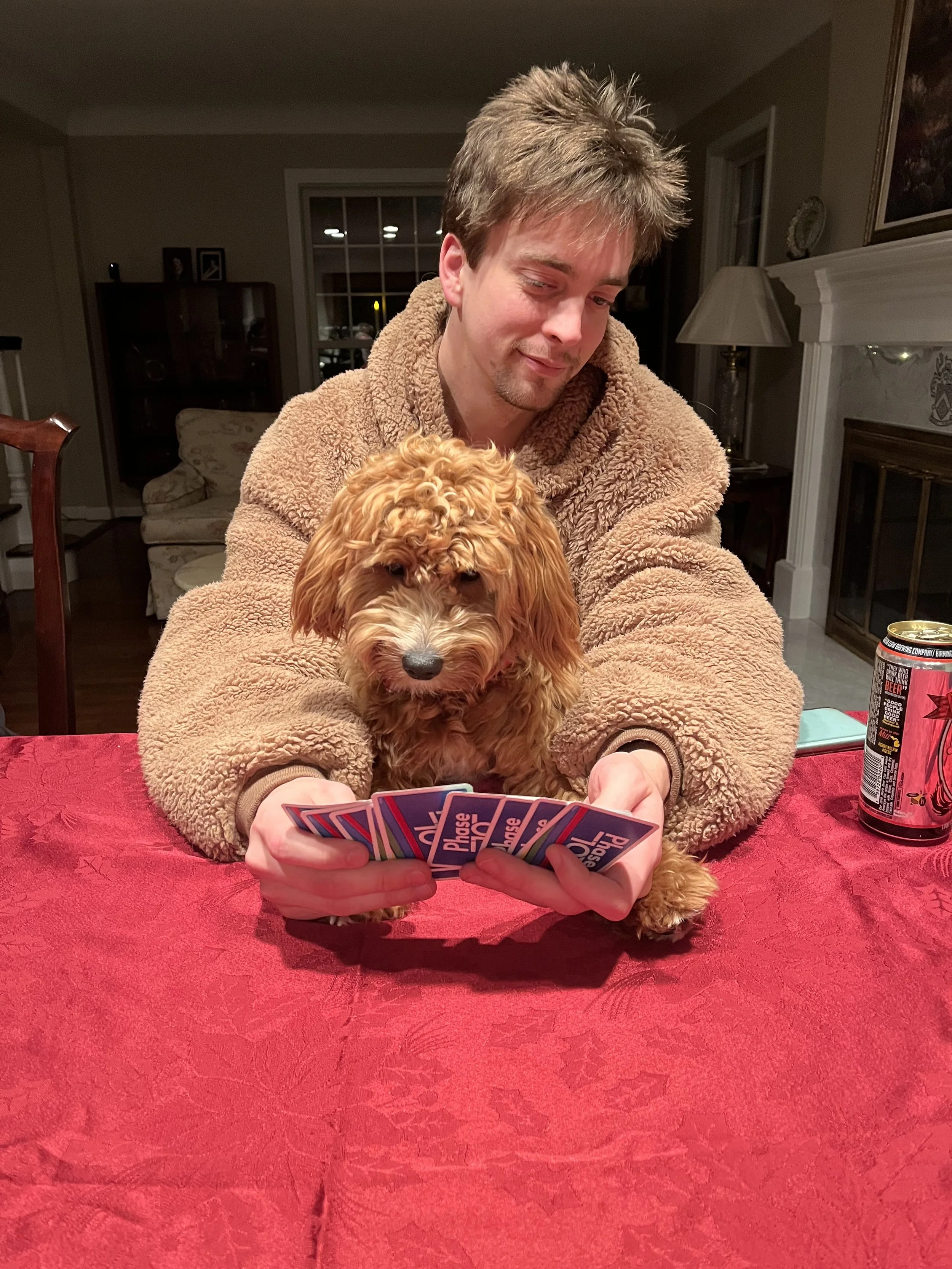 Sammy sharing my sweatshirt and helping me win a round of Uno.
