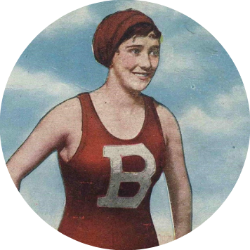 A 1920s bather in a red suit and cap. The suit has a white capital letter B on it.