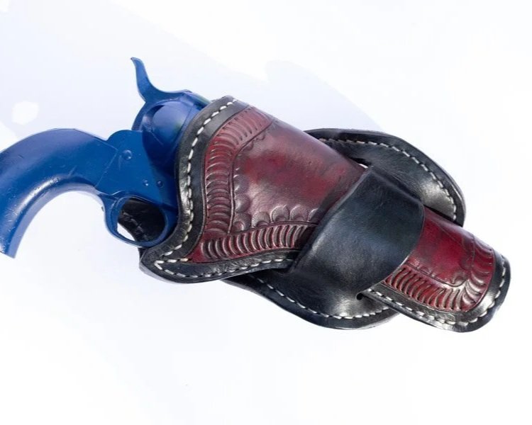 A burgundy red and black leather gun holster.