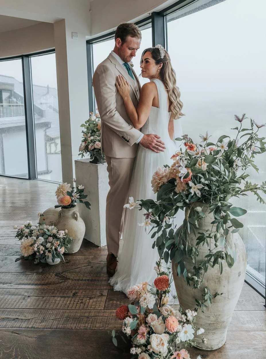 bride and groom in embrace at Devon wedding