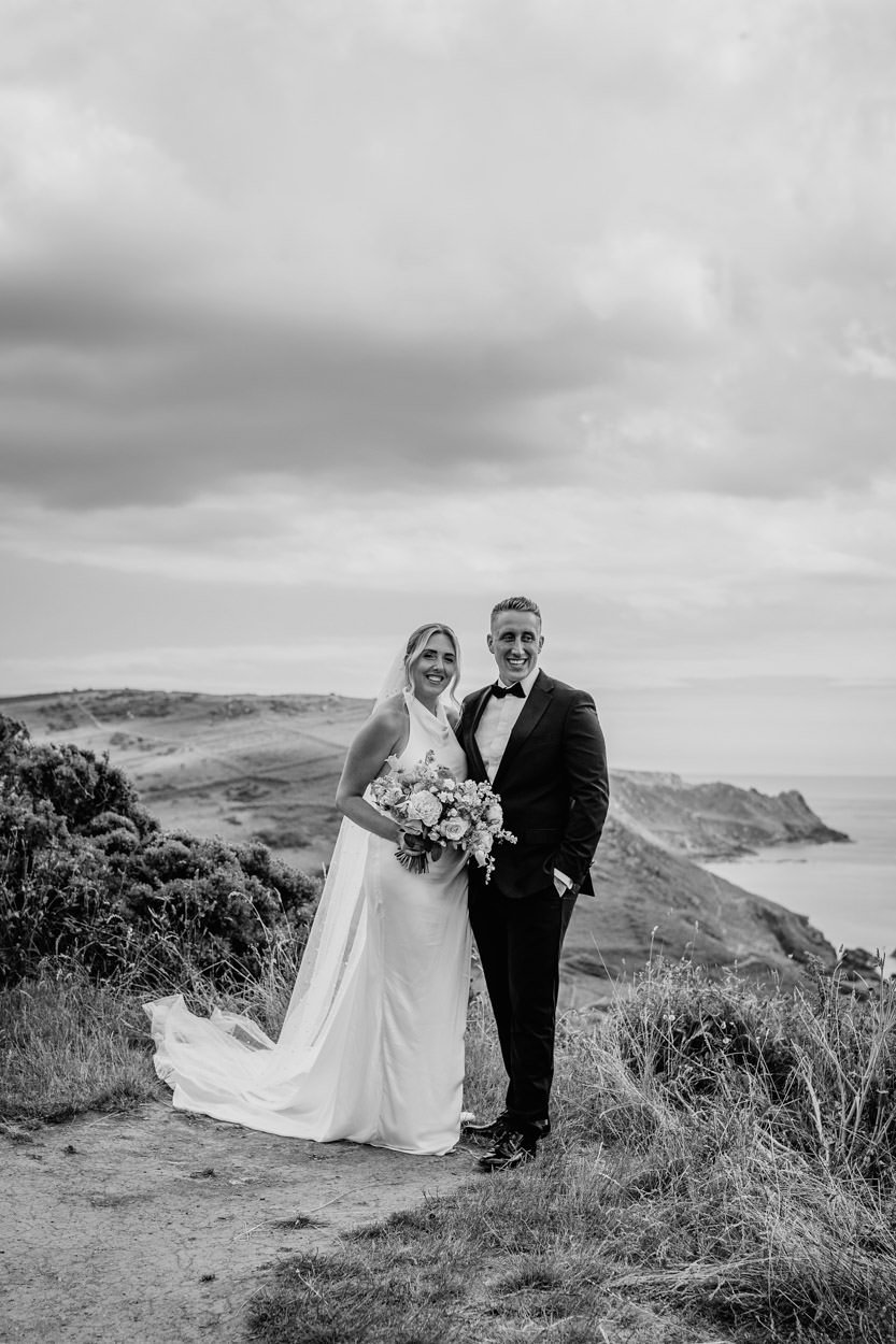 Black and white bridal shot on devon cliff top