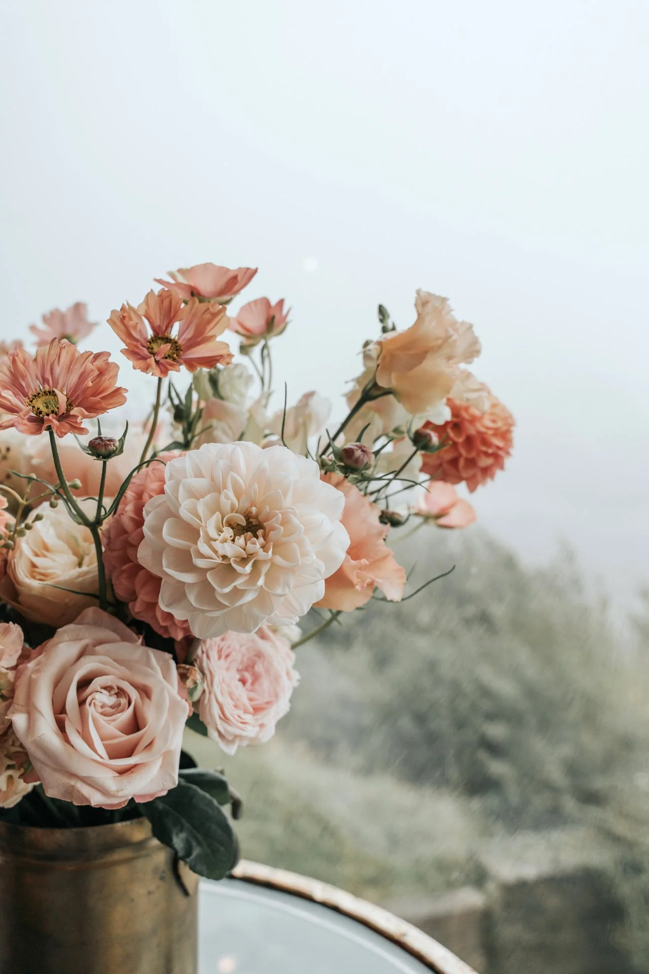 peach floral display Devon coastal wedding
