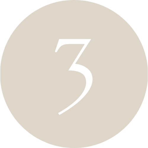 A beige circle with the number 3 in white in the center.