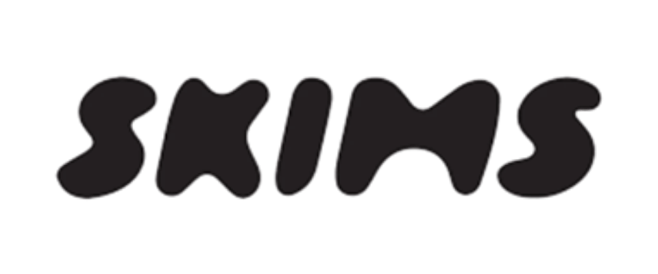 The word 'skins' written in black, stylized text on a white background.
