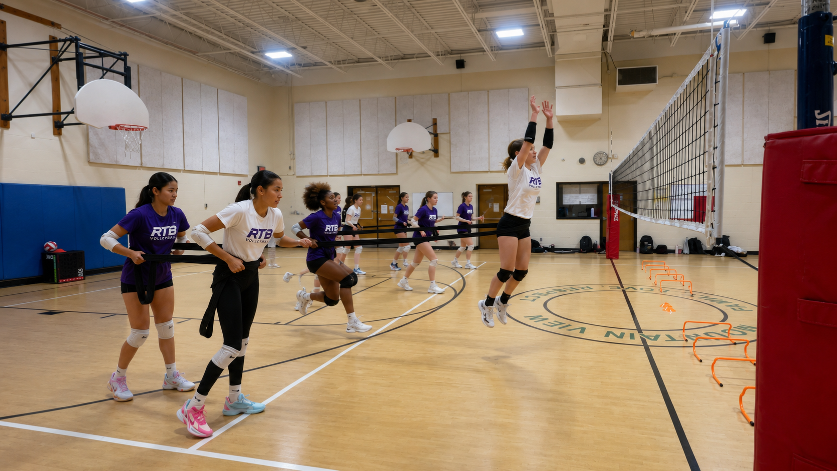 RTB volleyball team in Northern Virginia training with resistance bands during RTB Volleyball indoor practice session focused on athletic performance and jumping drills.
